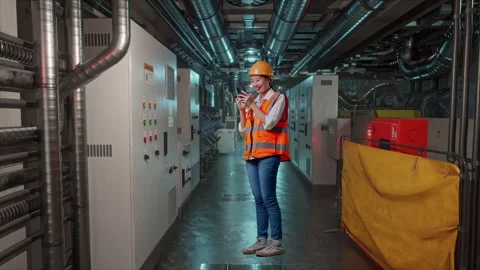 Female Engineer Using Smartphone In Engine Control Room Stock Footage 292371874