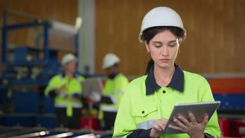 Female engineer using tablet at modern factory. Stock-Footage 229367361
