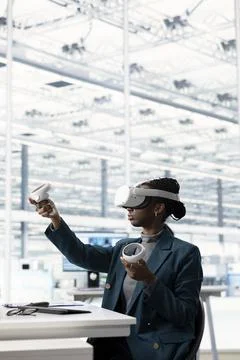 Female engineer using VR glasses to do microchip yield enhancement Stock Photos