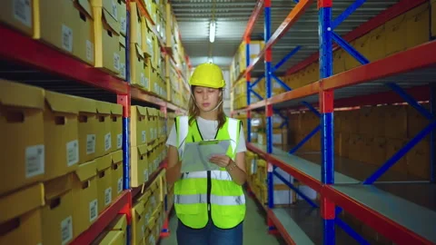 Female engineer walking in warehouse store. Stock Footage 241586853