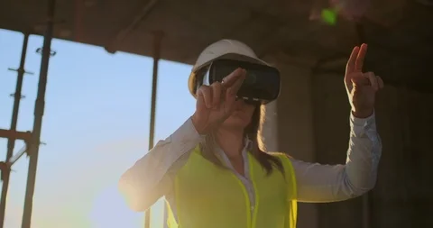 Female Engineer Wearing VR Headset managing construction project Stock Footage 113050903