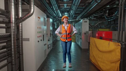 Female Engineer While Standing With Arms Akimbo In Engine Control Room Stock Footage 292370429