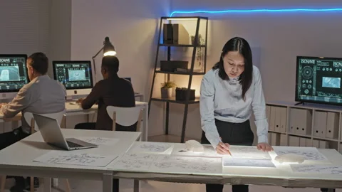 Female Engineer Working on Blueprints and Posing in Office Stock Footage 155250163