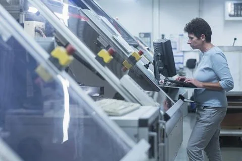 Female engineer working on computer in industry, Hanover, Lower Saxony, Germany Stock Photos