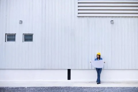 Female engineer working at construction site. Stock Photos