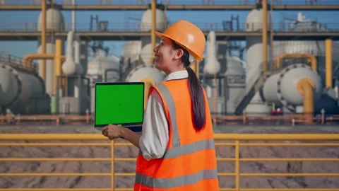 Female Engineer Working On A Green Screen Laptop at Energy Plant Stock Footage 331139684