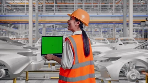 Female Engineer Working On A Green Screen Laptop In Car Factory Stock Footage 331632176