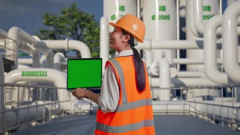 Female Engineer Working On A Green Screen Laptop at Biodiesel plant Stock Footage 332110553