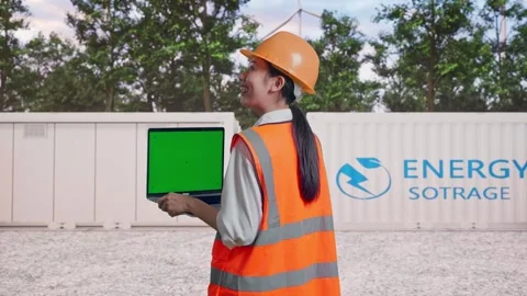 Female Engineer Working On A Green Screen Laptop with Energy Storage Stock Footage 337819387
