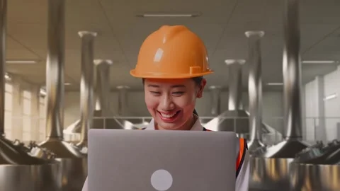 Female Engineer Working On A Laptop at Beer Plant Stock Footage 332547158