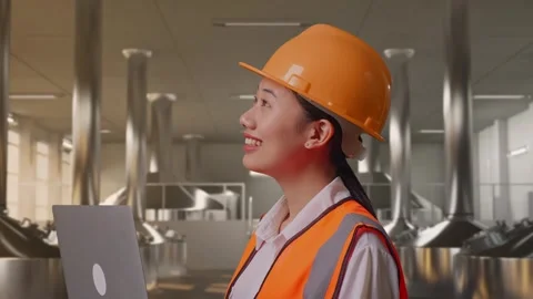 Female Engineer Working On A Laptop at Beer Plant Stock Footage 332547294