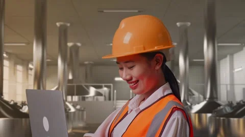 Female Engineer Working On A Laptop at Beer Plant Stock Footage 332547306