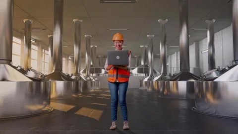 Female Engineer Working On A Laptop at Beer Plant Stock Footage 332547685