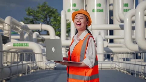 Female Engineer Working On A Laptop at Biodiesel plant Stock Footage 332109957
