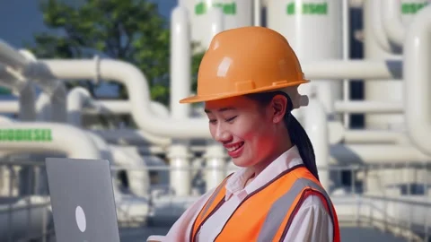 Female Engineer Working On A Laptop at Biodiesel plant Stock Footage 332116661