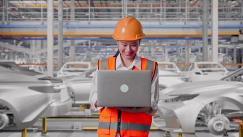Female Engineer Working On A Laptop In Car Factory Stock Footage 331632030