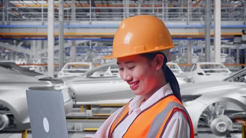 Female Engineer Working On A Laptop In Car Factory Stock Footage 331632680