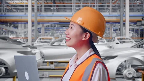 Female Engineer Working On A Laptop In Car Factory Stock Footage 331632693