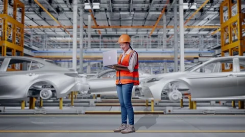 Female Engineer Working On A Laptop In Car Factory Stock Footage 331633615