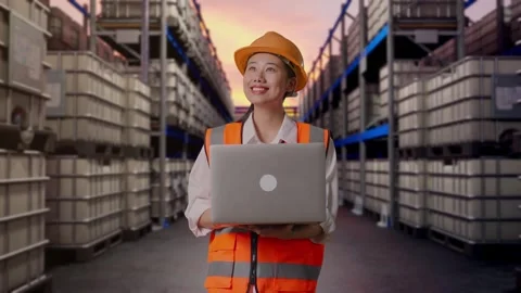 Female Engineer Working On A Laptop at Fuel Warehouse Stock Footage 332155800