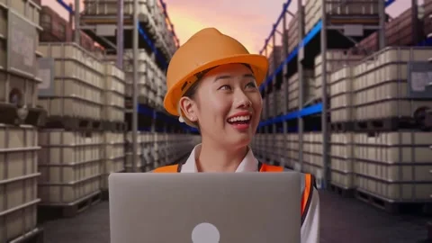 Female Engineer Working On A Laptop at Fuel Warehouse Stock Footage 332156375