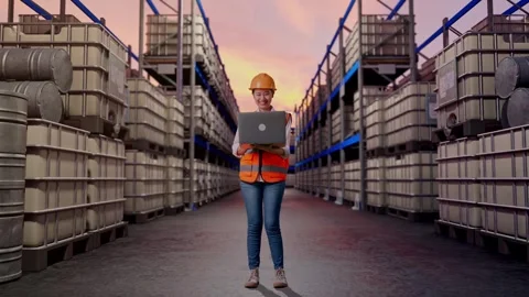 Female Engineer Working On A Laptop at Fuel Warehouse Stock Footage 332157667