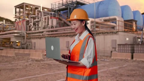 Female Engineer Working On A Laptop at Gas Plant Stock Footage 337762824