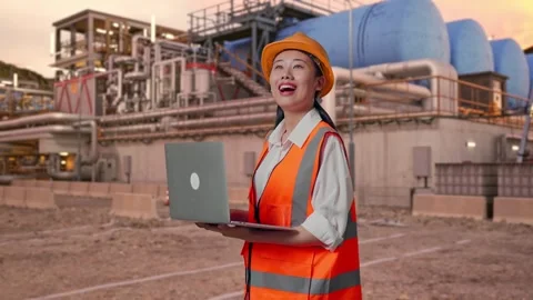 Female Engineer Working On A Laptop at Gas Plant Stock Footage 337762830