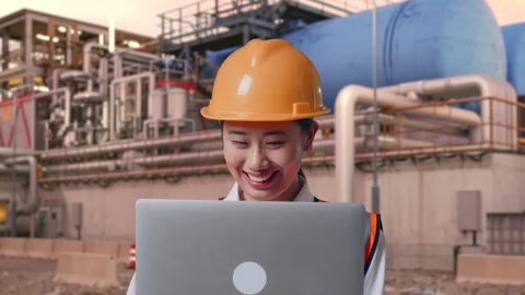 Female Engineer Working On A Laptop at Gas Plant Stock Footage 337763540