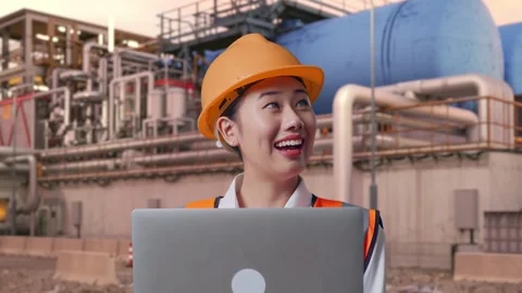 Female Engineer Working On A Laptop at Gas Plant Stock Footage 337763556
