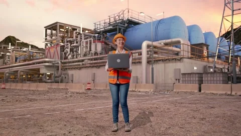 Female Engineer Working On A Laptop at Gas Plant Stock Footage 337764400