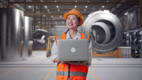 Female Engineer Working On A Laptop at Heavy Factory Stock Footage 340823676