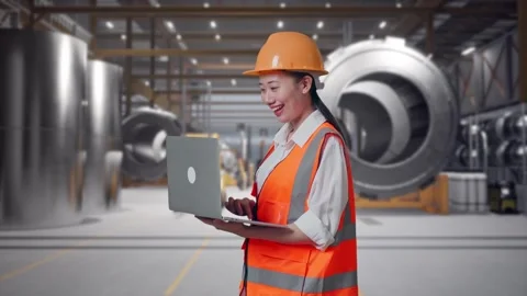 Female Engineer Working On A Laptop at Heavy Factory Stock Footage 340824400