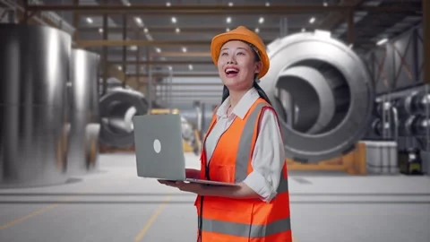 Female Engineer Working On A Laptop at Heavy Factory Stock Footage 340824408