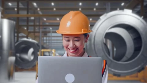 Female Engineer Working On A Laptop at Heavy Factory Stock Footage 340825148