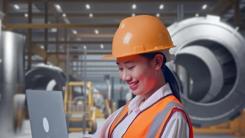 Female Engineer Working On A Laptop at Heavy Factory Stock Footage 340825398