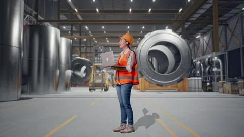Female Engineer Working On A Laptop at Heavy Factory Stock Footage 340826299
