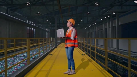 Female Engineer Working On A Laptop, Plastic Recycling Factory Stock Footage 315156660