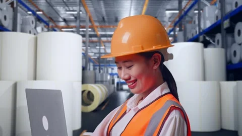 Female Engineer Working On A Laptop at Polymer Plant Stock Footage 334532590