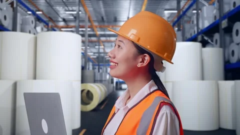 Female Engineer Working On A Laptop at Polymer Plant Stock Footage 334532622