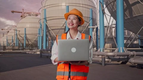 Female Engineer Working On A Laptop with Spherical Tank Stock Footage 335068497