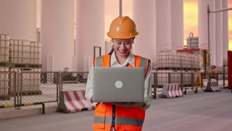 Female Engineer Working On A Laptop at Storage Facility Stock Footage 337753716