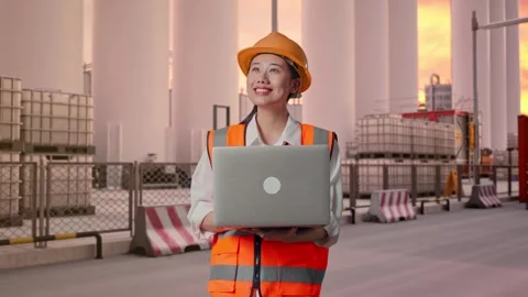Female Engineer Working On A Laptop at Storage Facility Stock Footage 337753763