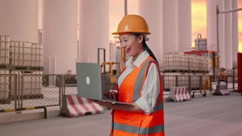 Female Engineer Working On A Laptop at Storage Facility Stock Footage 337753960