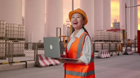 Female Engineer Working On A Laptop at Storage Facility Stock Footage 337753984