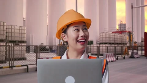 Female Engineer Working On A Laptop at Storage Facility Stock Footage 337754627