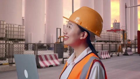 Female Engineer Working On A Laptop at Storage Facility Stock Footage 337754927