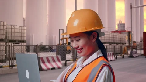 Female Engineer Working On A Laptop at Storage Facility Stock Footage 337754931