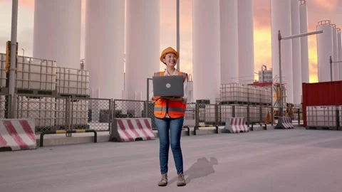 Female Engineer Working On A Laptop at Storage Facility Stock Footage 337755460