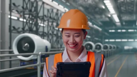Female Engineer Working On A Tablet, Aircraft Engine Factory Video stock 314608501